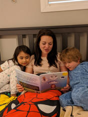 Mother reading to kids